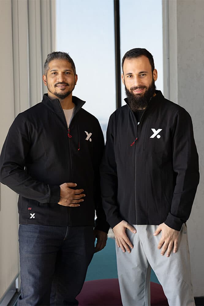 Two of the team at the office window